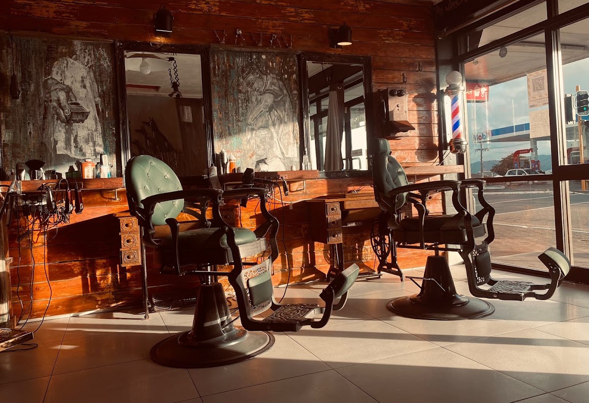 Inside Unique Cut 48: antique barber chairs, murals and golden afternoon light