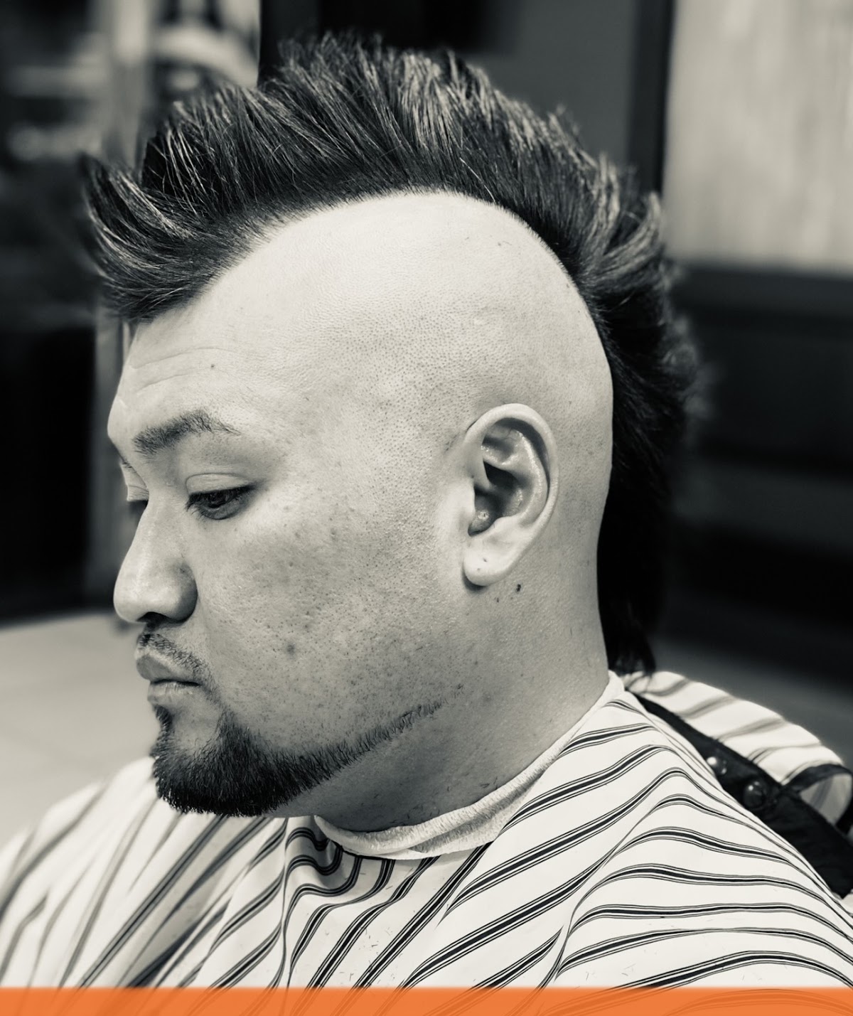 Mohawk fade with shaped beard
